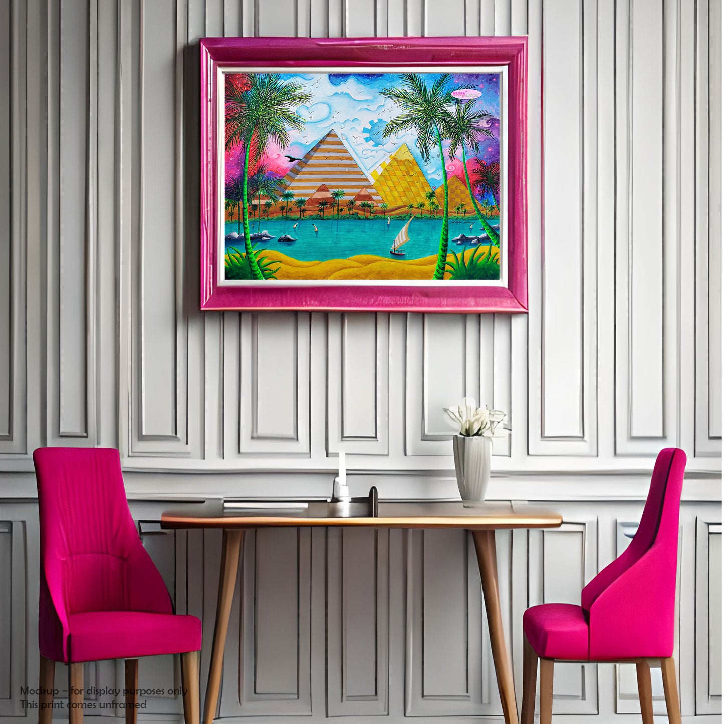 pink frame white walls pink chairs room setting of pyramids of giza travel poster print from original whimsical colorful pop art style painting by traveling artist meganaroon